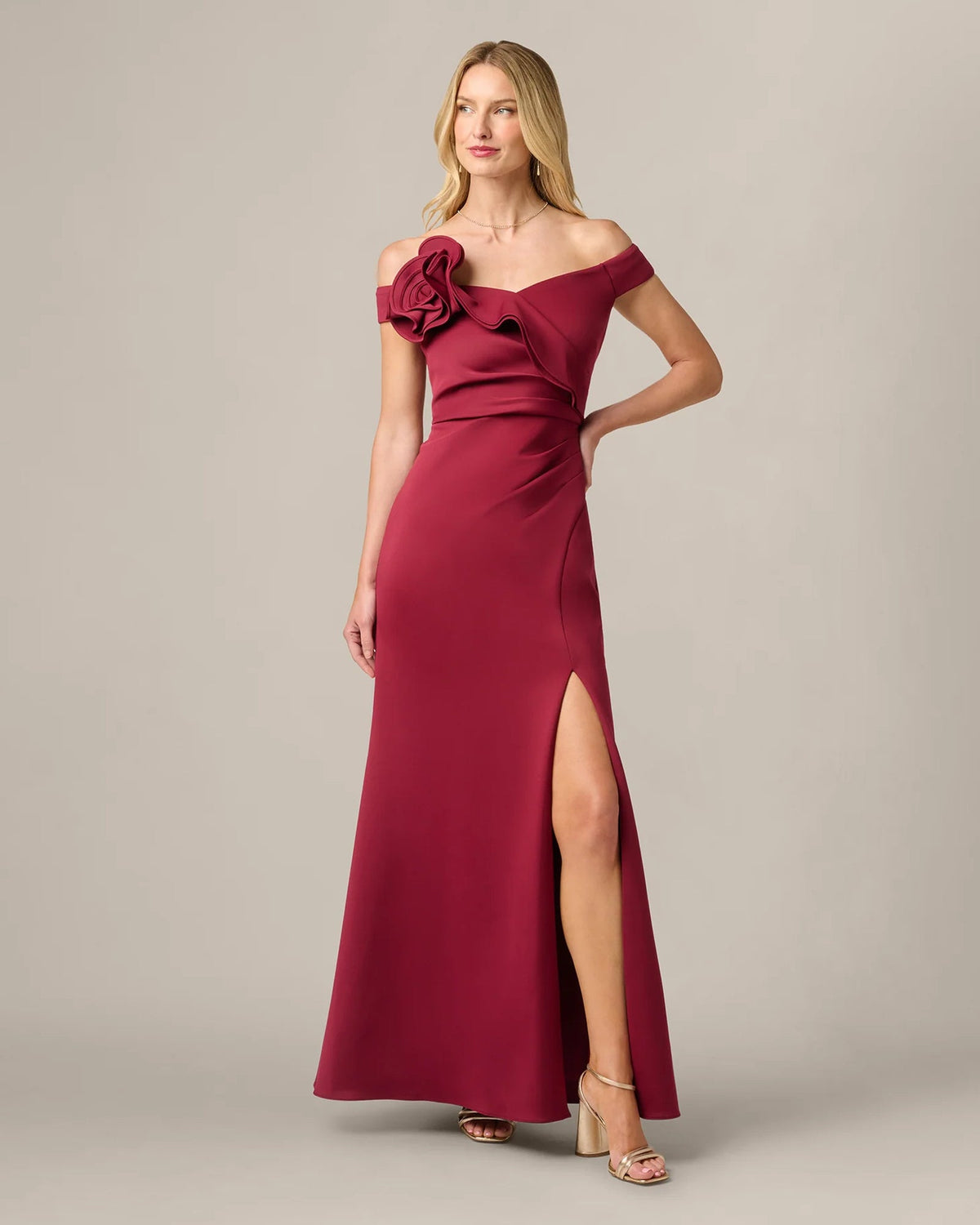 Crimson red off-shoulder mermaid maxi dress with rosette detail and front slit