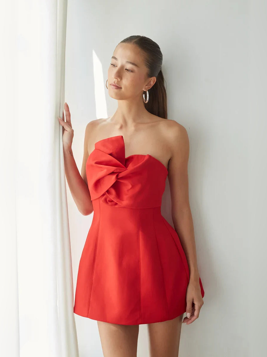 Red strapless A-line mini dress with oversized bow neckline