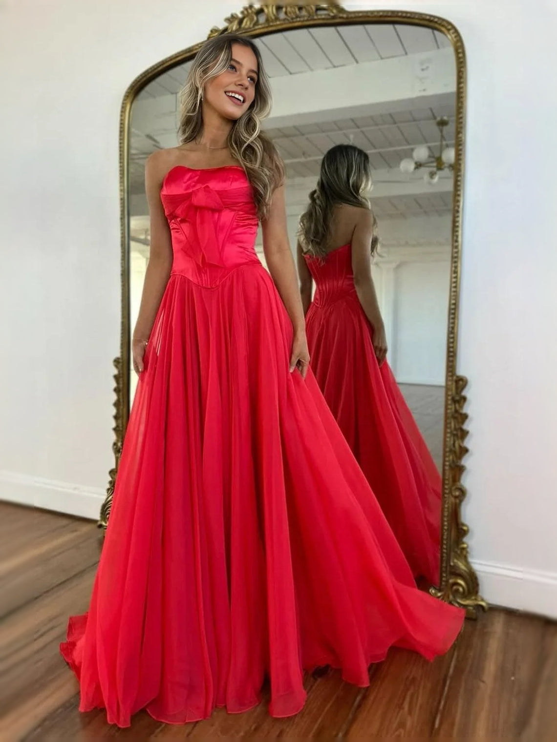 Red strapless corset A-line prom dress with pleated floor-length skirt