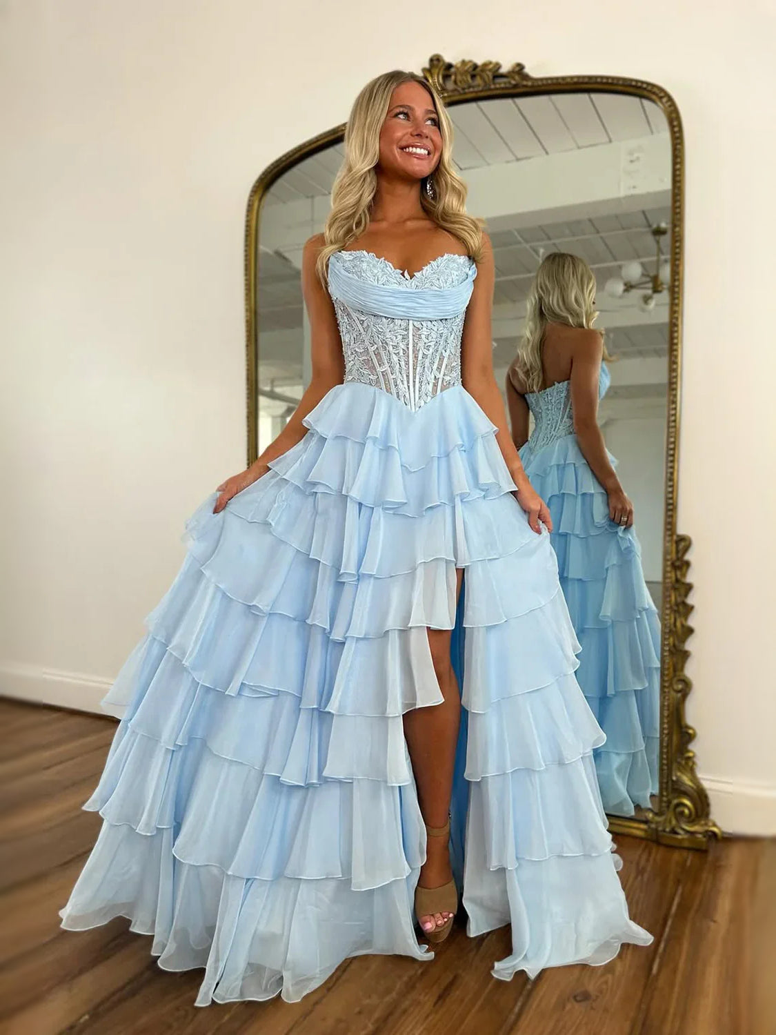 Light blue strapless corset prom dress with cascading tiered ruffles and high-low skirt