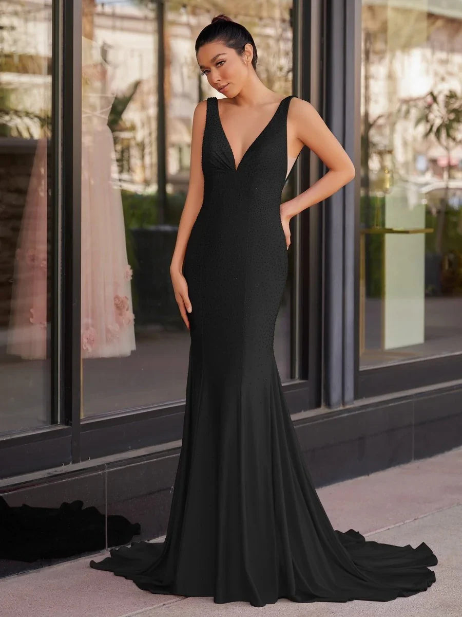 Black beaded v-neck sleeveless mermaid maxi prom dress with fitted waist and flare