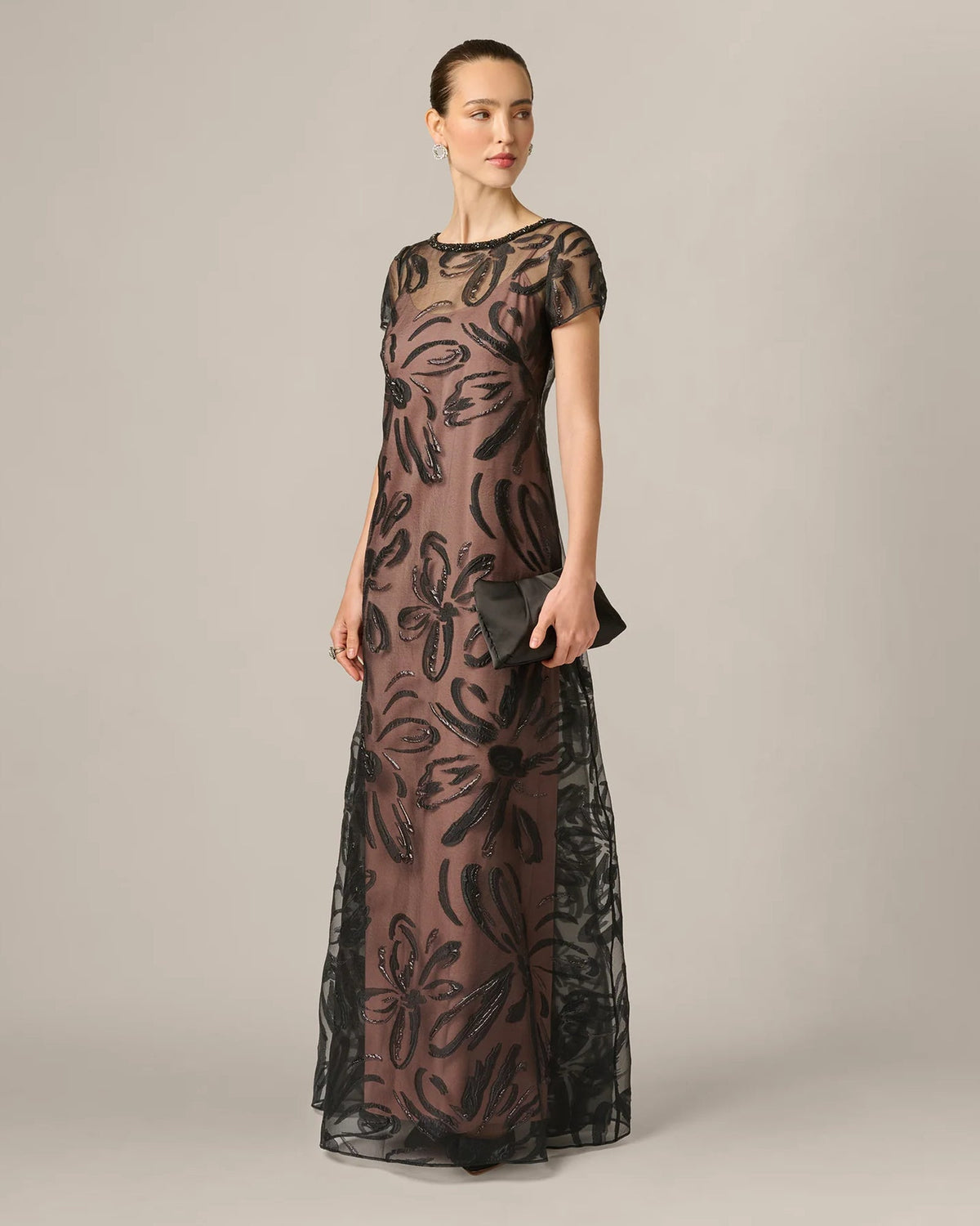 Black A-line maxi dress front view, short sleeves, embroidered floral motifs