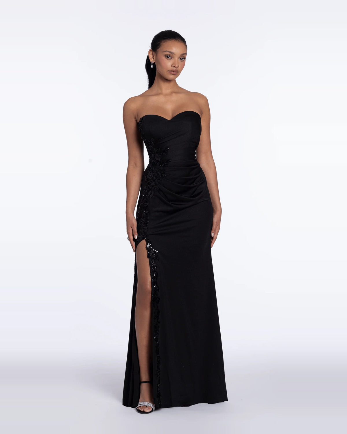 Black strapless sweetheart column maxi evening dress with ruched bodice and front slit