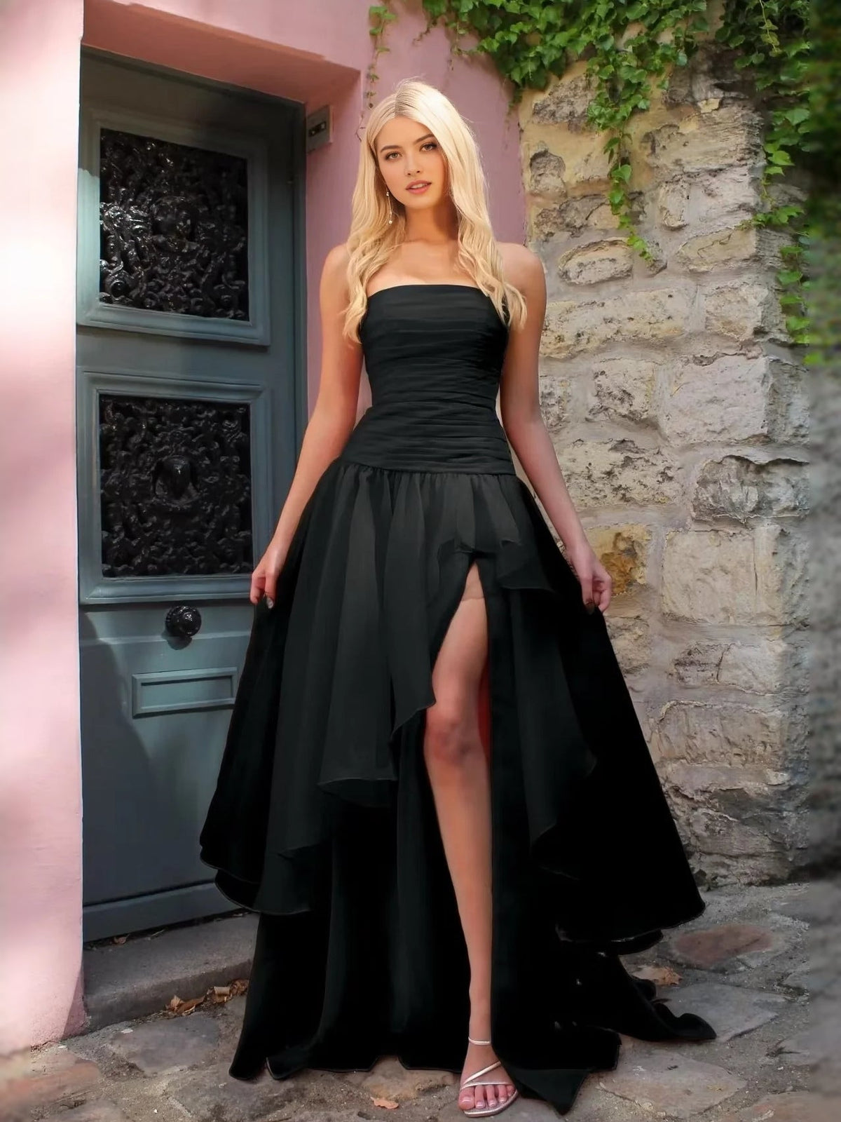 Black strapless A-line prom dress with ruched bodice and high-low front slit hem