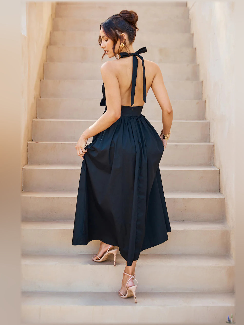Black halter midi dress, open back with bow-tie strap