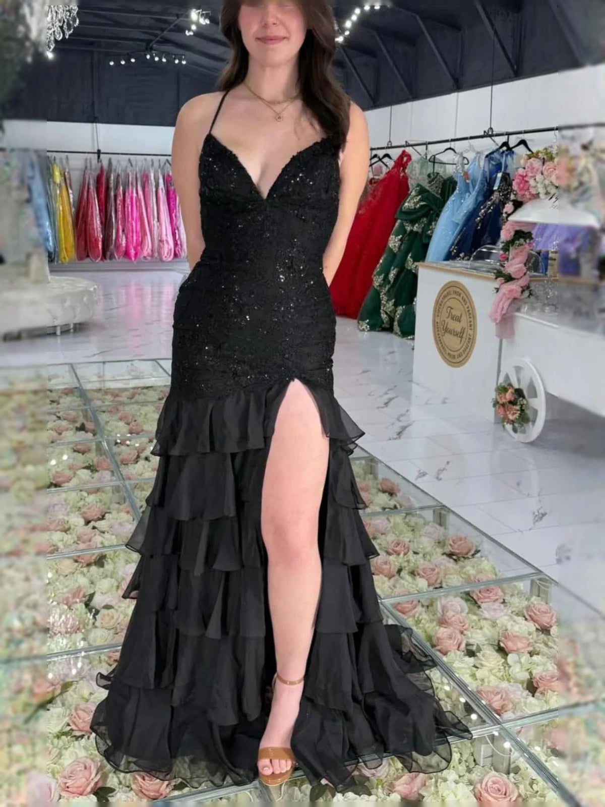 Black strapless V-neck prom dress with glitter texture, tiered ruffles and front slit