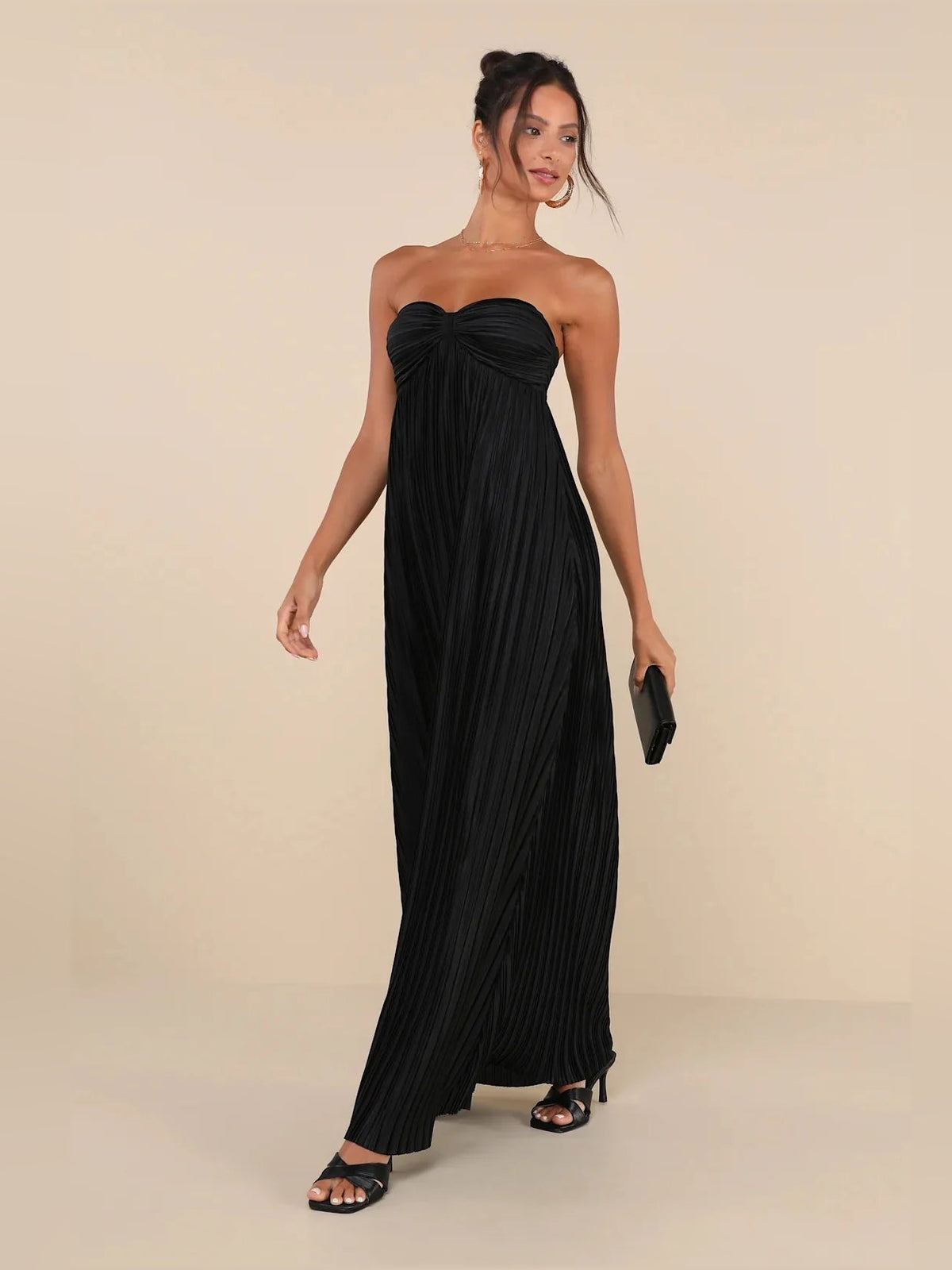 Black strapless satin maxi dress with ruched sweetheart bodice and pleated column silhouette
