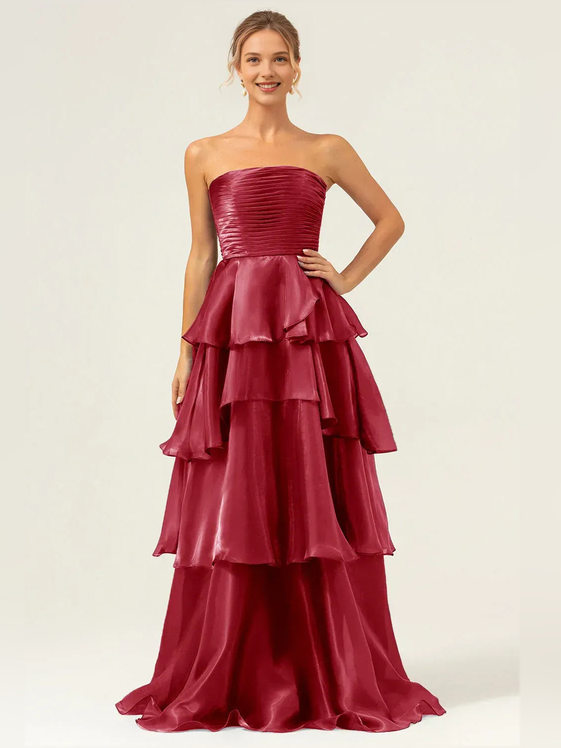 Burgundy strapless prom dress with ruched bodice and tiered ruffle skirt, floor length