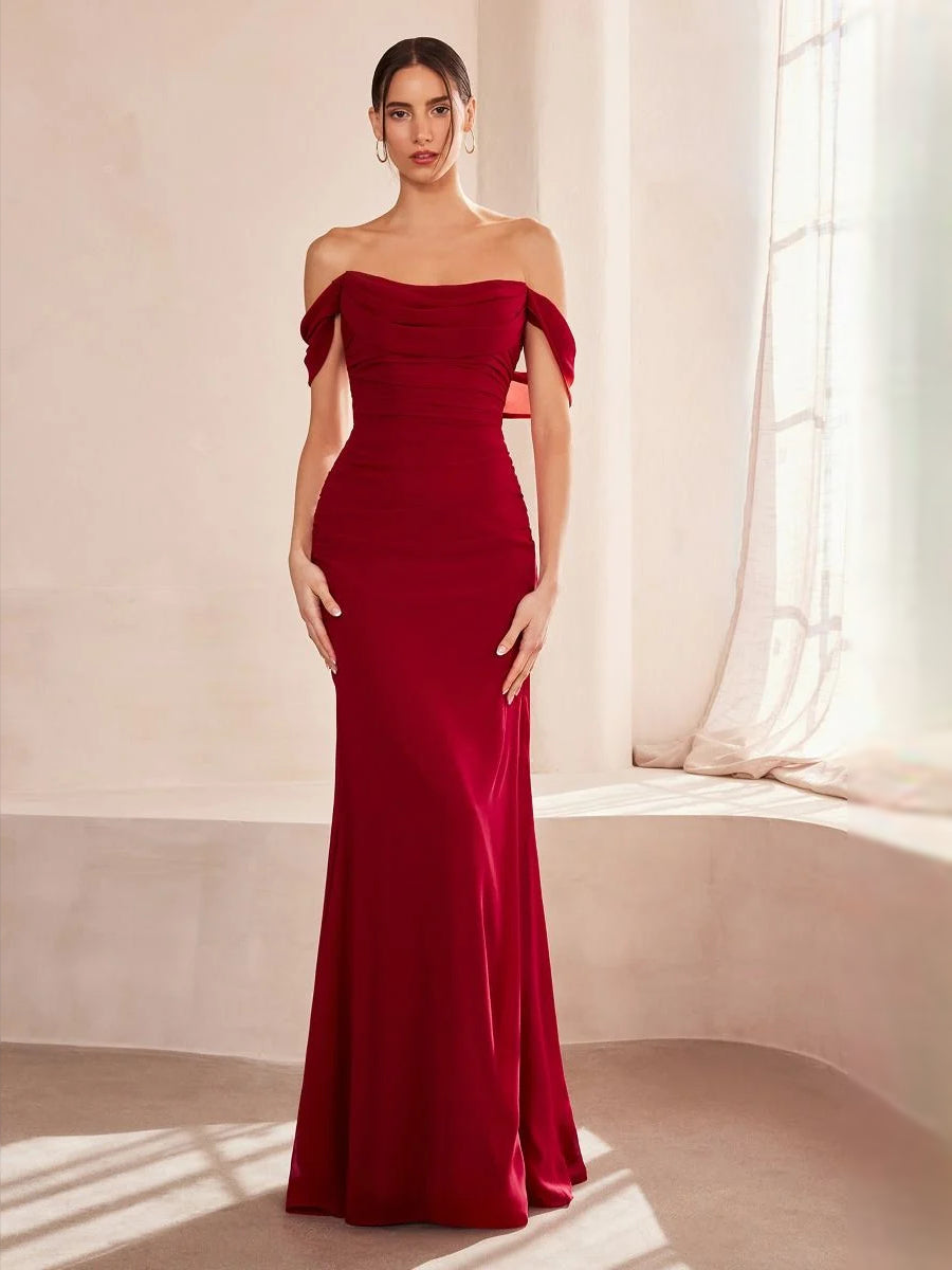 Mermaid off-shoulder ruched gown, burgundy red, fitted bodice and draped skirt.
