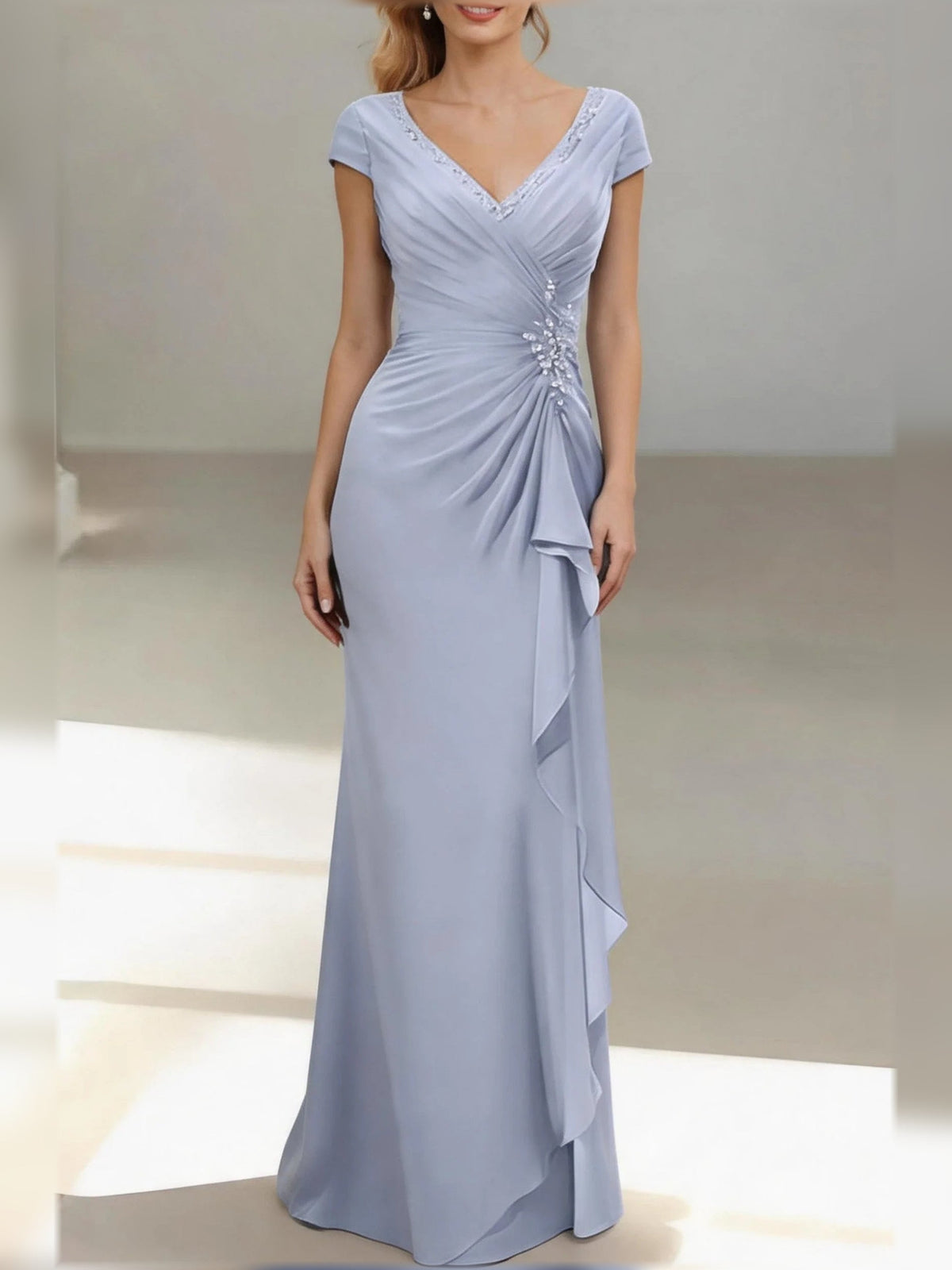 Dusty blue V-neck ruched mermaid gown with cap sleeves and draped ruffle skirt