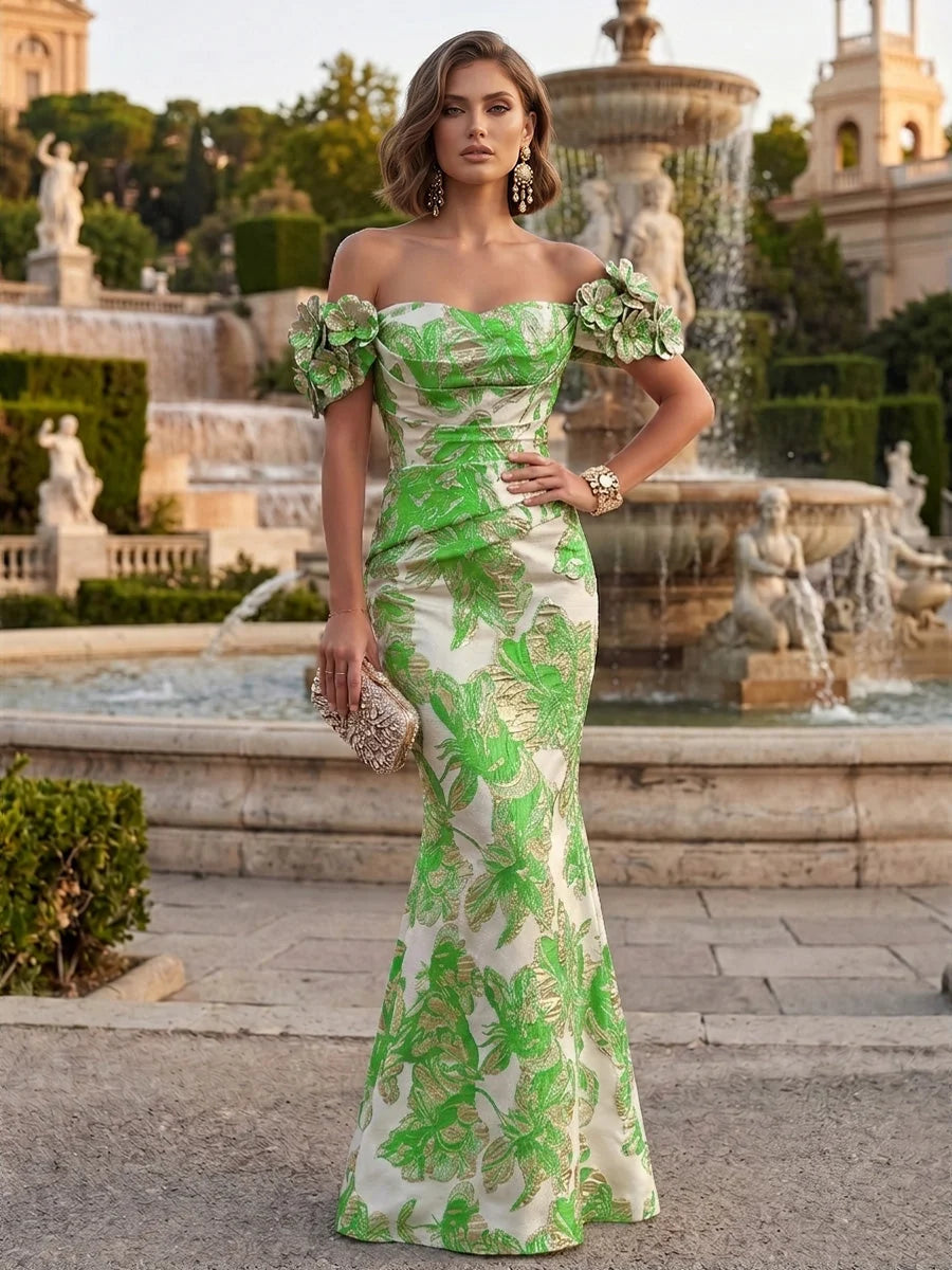 Green off-shoulder mermaid gown with ruched bodice and floral applique
