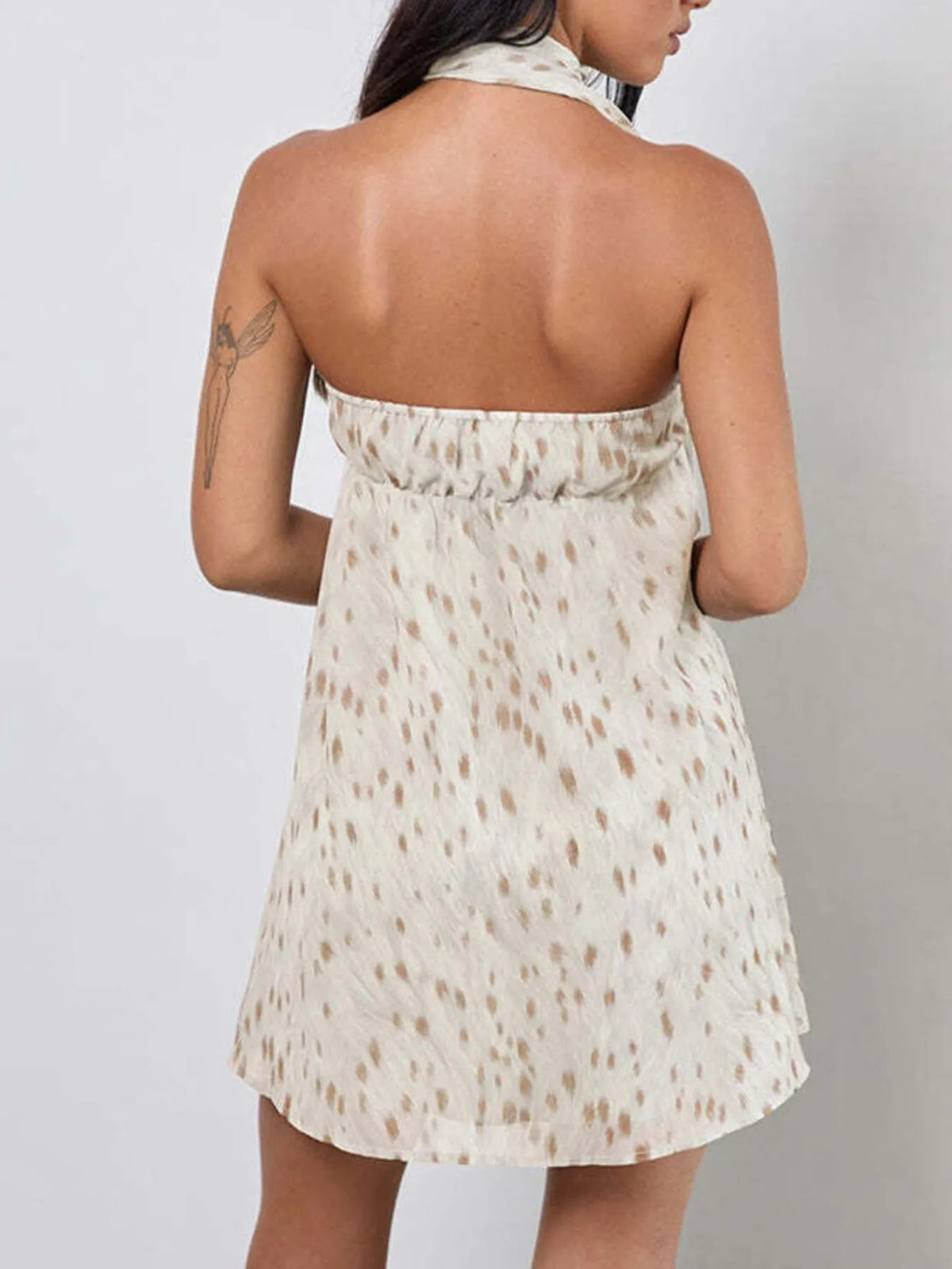 Sweetheart mini dress back view with scooped opening, speckled off-white short skirt