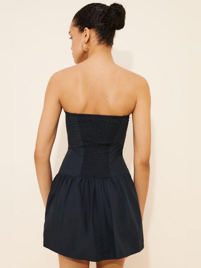 Black strapless mini dress back view with pleated waist and gathered skirt