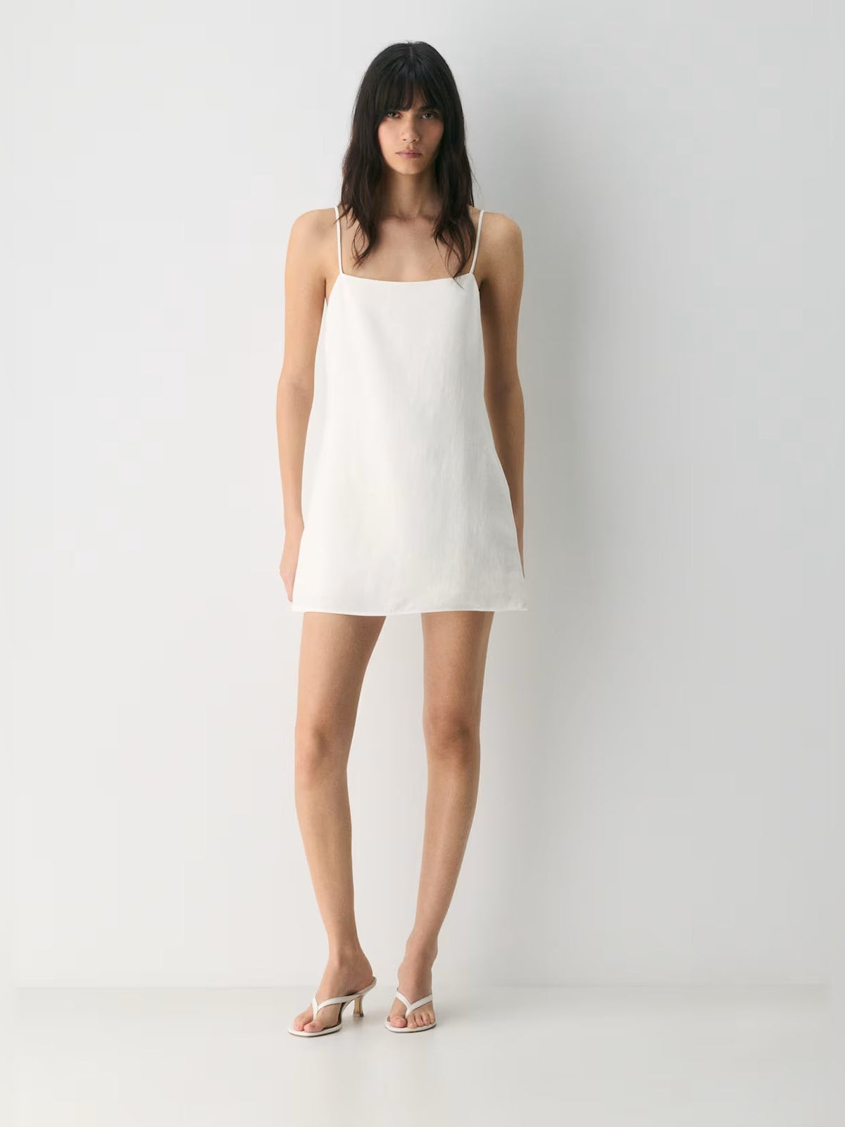 White square-neck mini dress with spaghetti straps, full front view