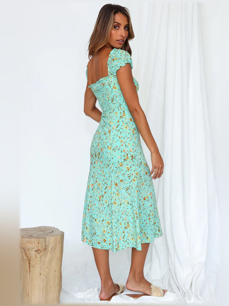 Aqua floral midi off-shoulder dress side profile, ruffle sleeves and front slit.