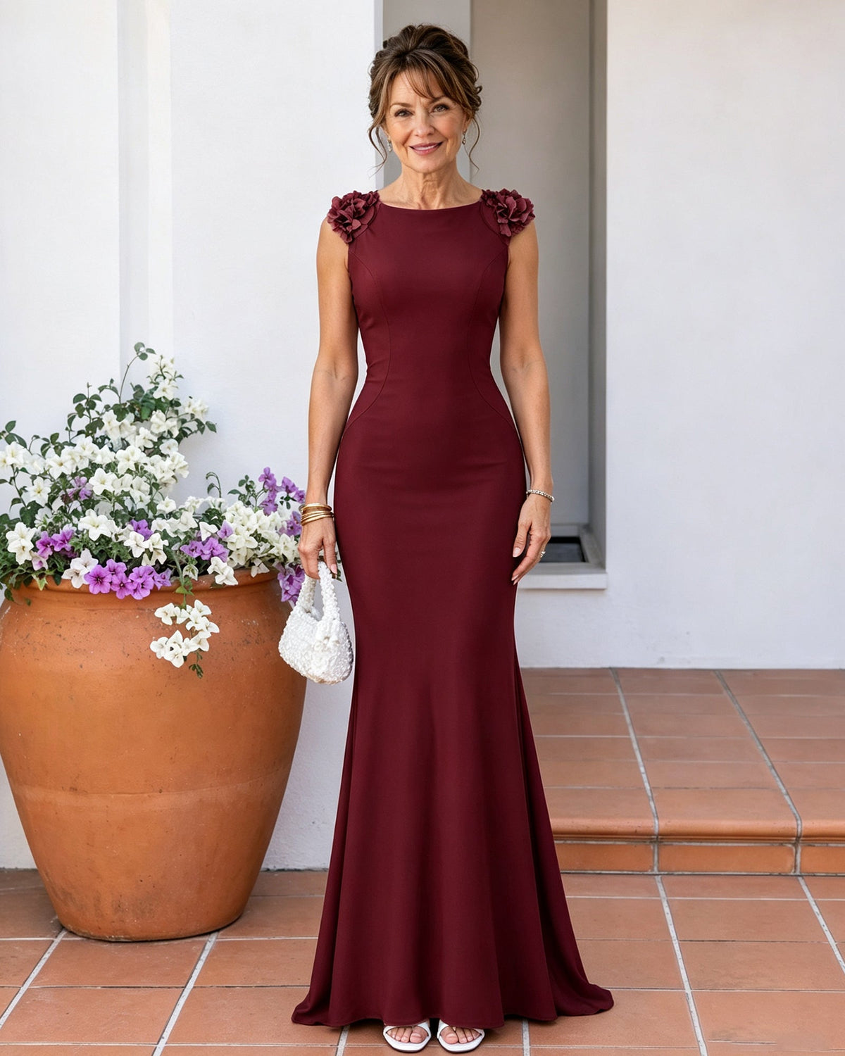 Burgundy mermaid mother-of-the-bride dress with ruffled shoulders and sleeveless bodice