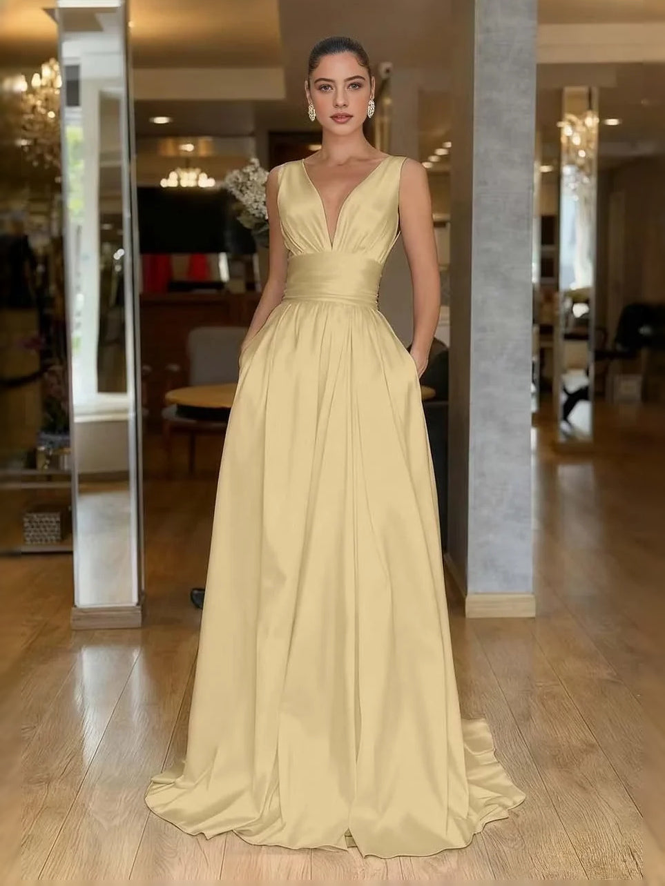 Light yellow V-neck A-line prom dress with ruched bodice and pleated floor-length skirt
