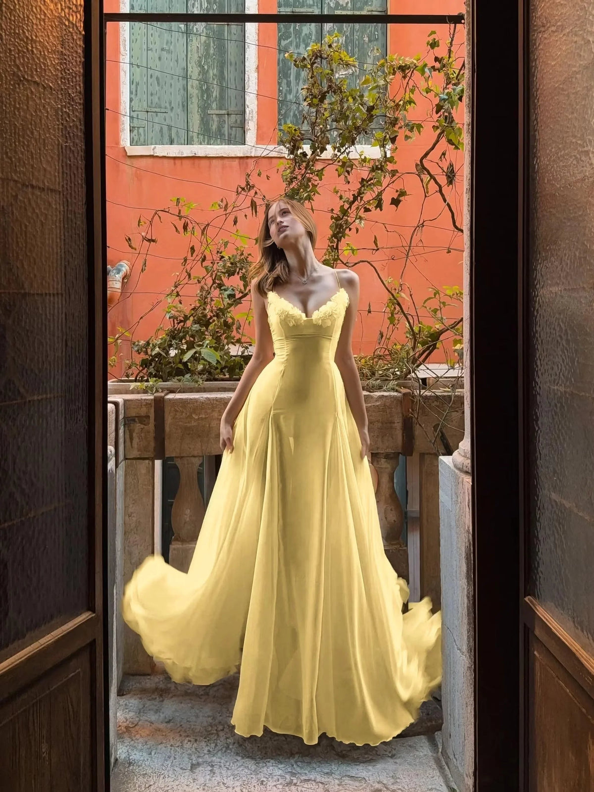 Yellow sleeveless sweetheart A-line prom dress with draped floor-length skirt