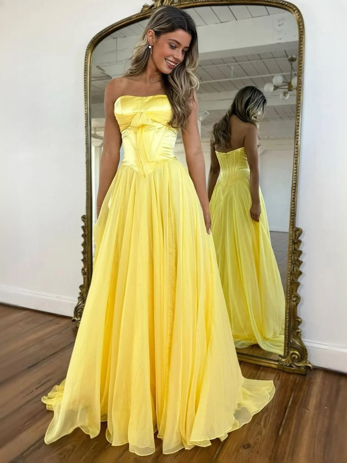Yellow strapless corset A-line prom dress with pleated floor-length skirt