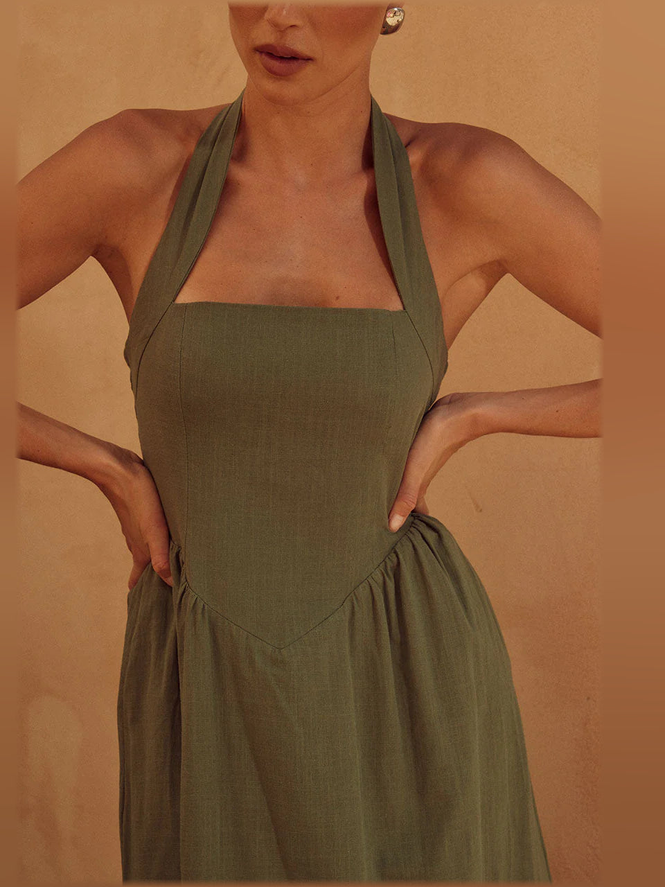 Khaki midi formal dress close-up of halter neckline and gathered waist detail