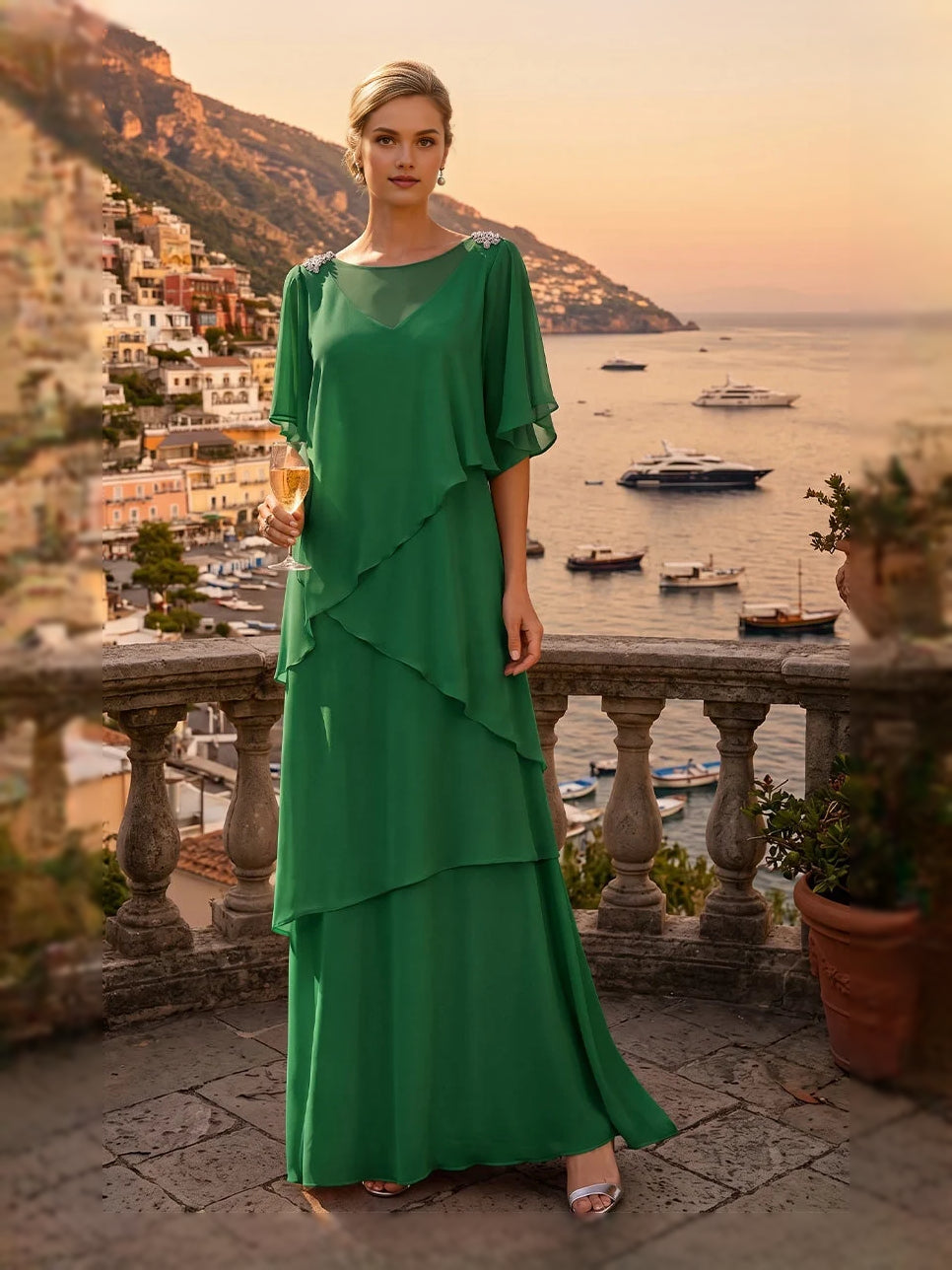 Emerald green chiffon floor-length dress with tiered ruffles and flutter sleeves