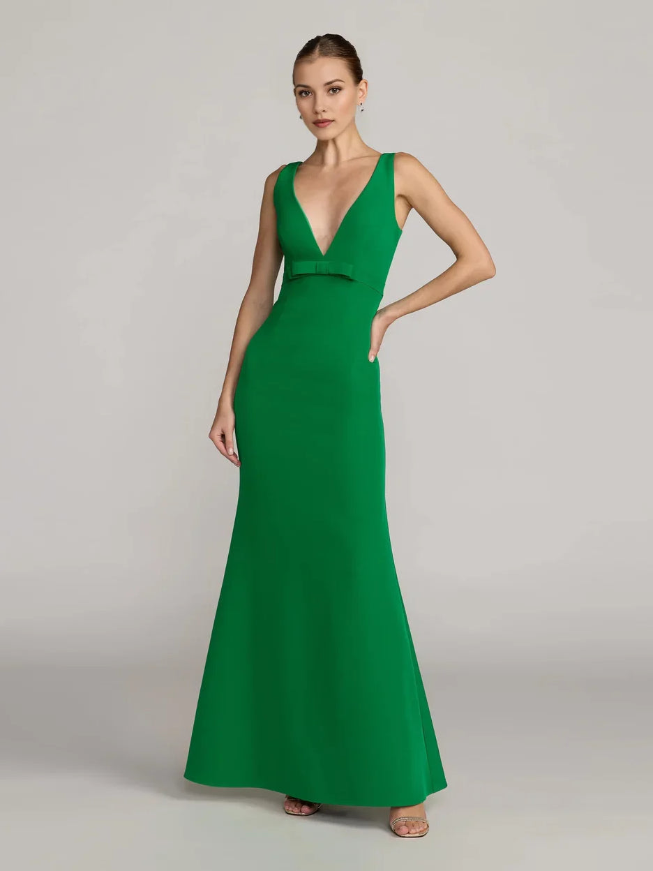 Emerald green sleeveless V-neck mermaid formal dress with fitted waist, floor-length