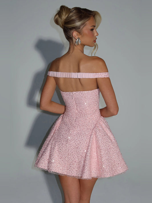Blush pink sequined off-shoulder mini dress from side, fitted waist, flared skirt