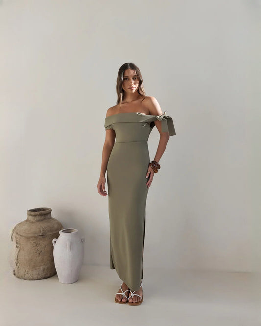 Olive green structured satin A-line maxi dress with off-shoulder neckline and bow cuffs