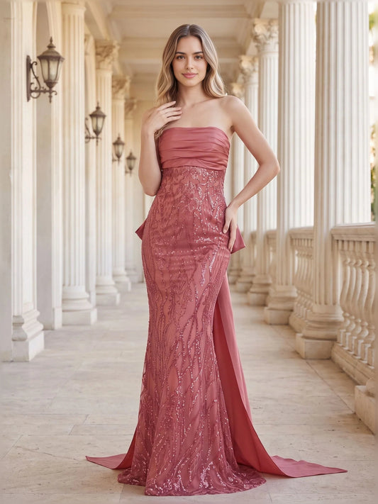 Dusty rose strapless formal gown with ruched bodice and floor-length silhouette