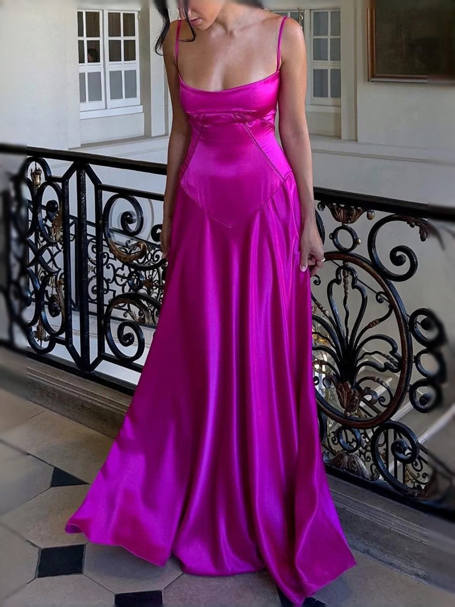 Hot pink satin square-neck A-line prom dress with thin straps and long flowing skirt.