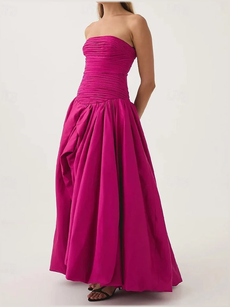 Hot pink strapless maxi dress with ruched bodice and full pleated A-line skirt