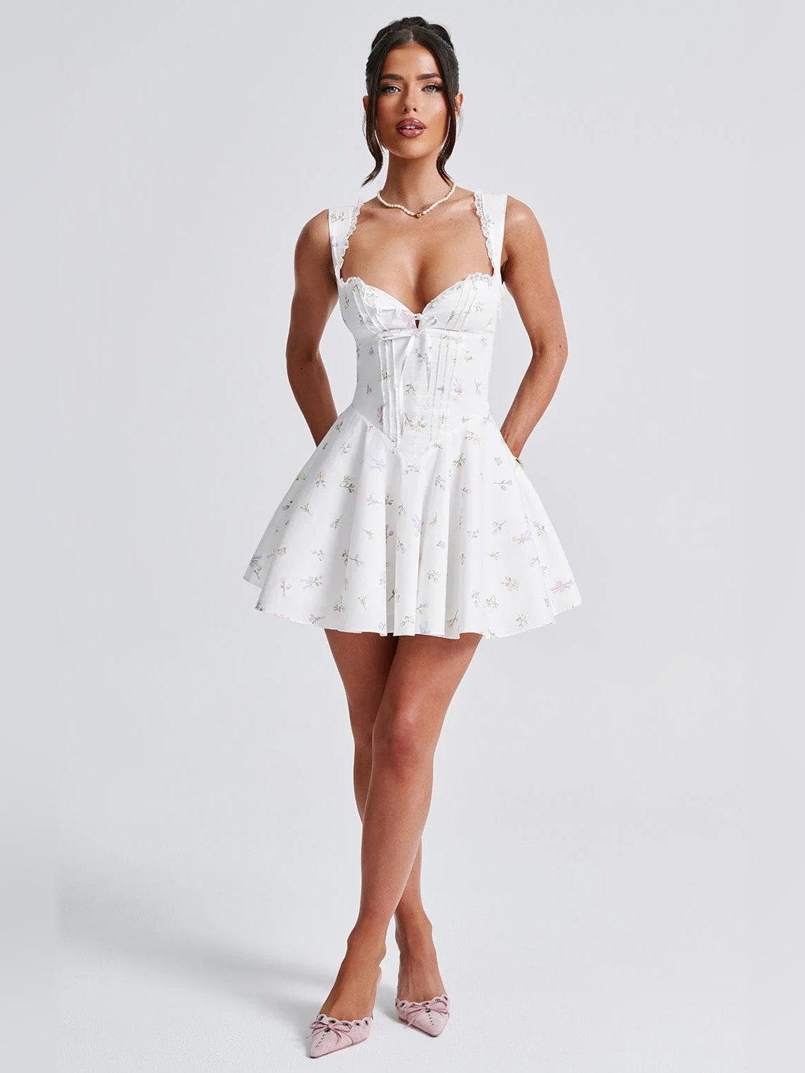 White mini dress with floral print, sweetheart bodice, lace trim and flared skirt