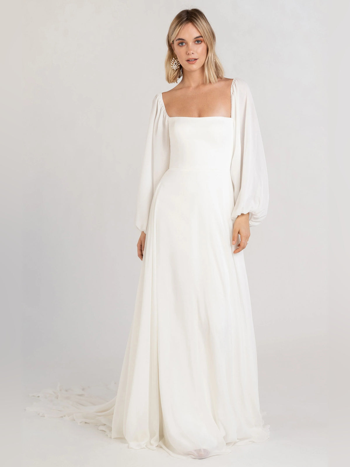 Off-white square-neck A-line formal dress with long puff sleeves and smooth skirt