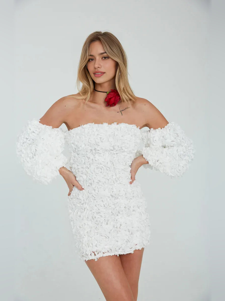 White off-shoulder bodycon mini dress with floral ruffle texture and red flower at neck