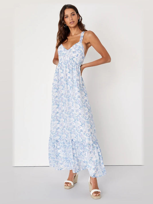 Blue and white floral maxi dress with V-neck, spaghetti straps, and tiered skirt