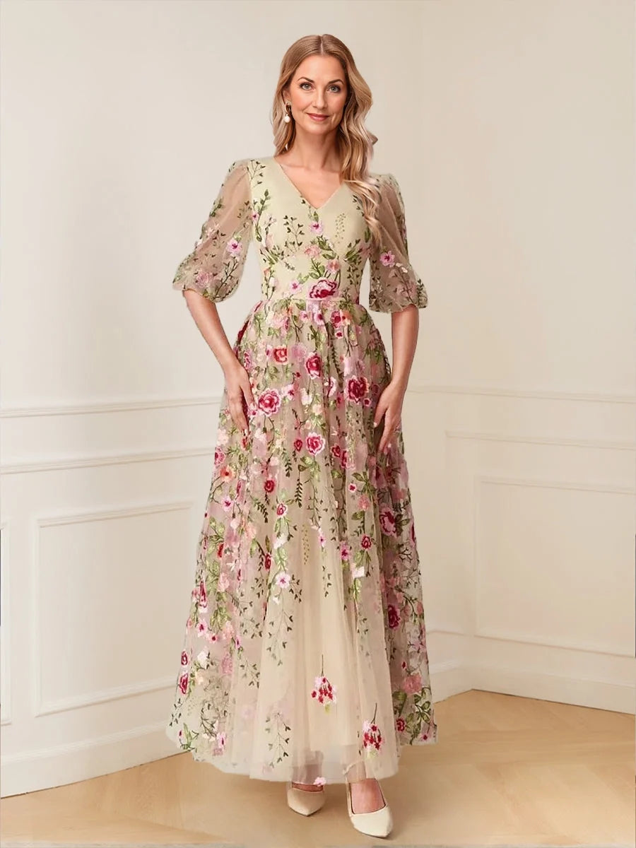 Ivory embroidered floral V-neck A-line tulle dress with puff sleeves and full skirt
