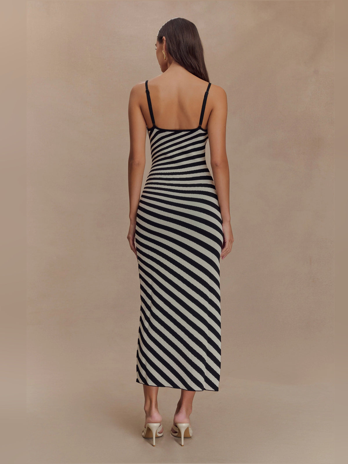 Black-and-white striped knit midi dress with open back, spaghetti straps, bodycon fit