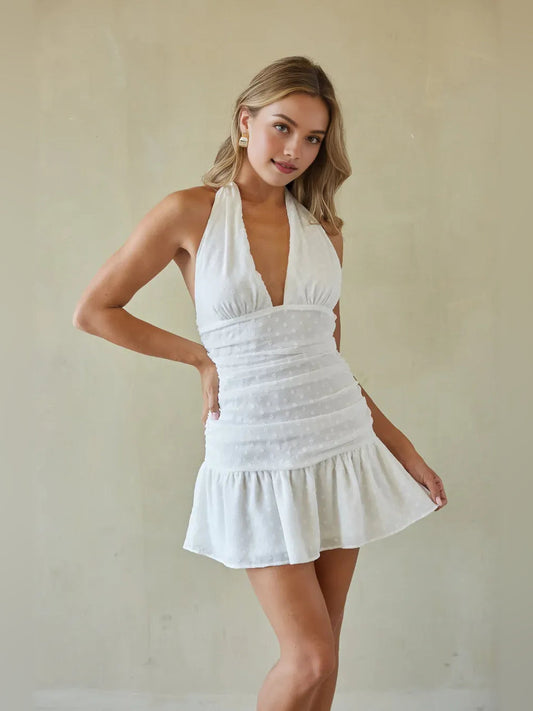 White sleeveless ruched V-neck mini A-line dress with ruffled waist and skirt