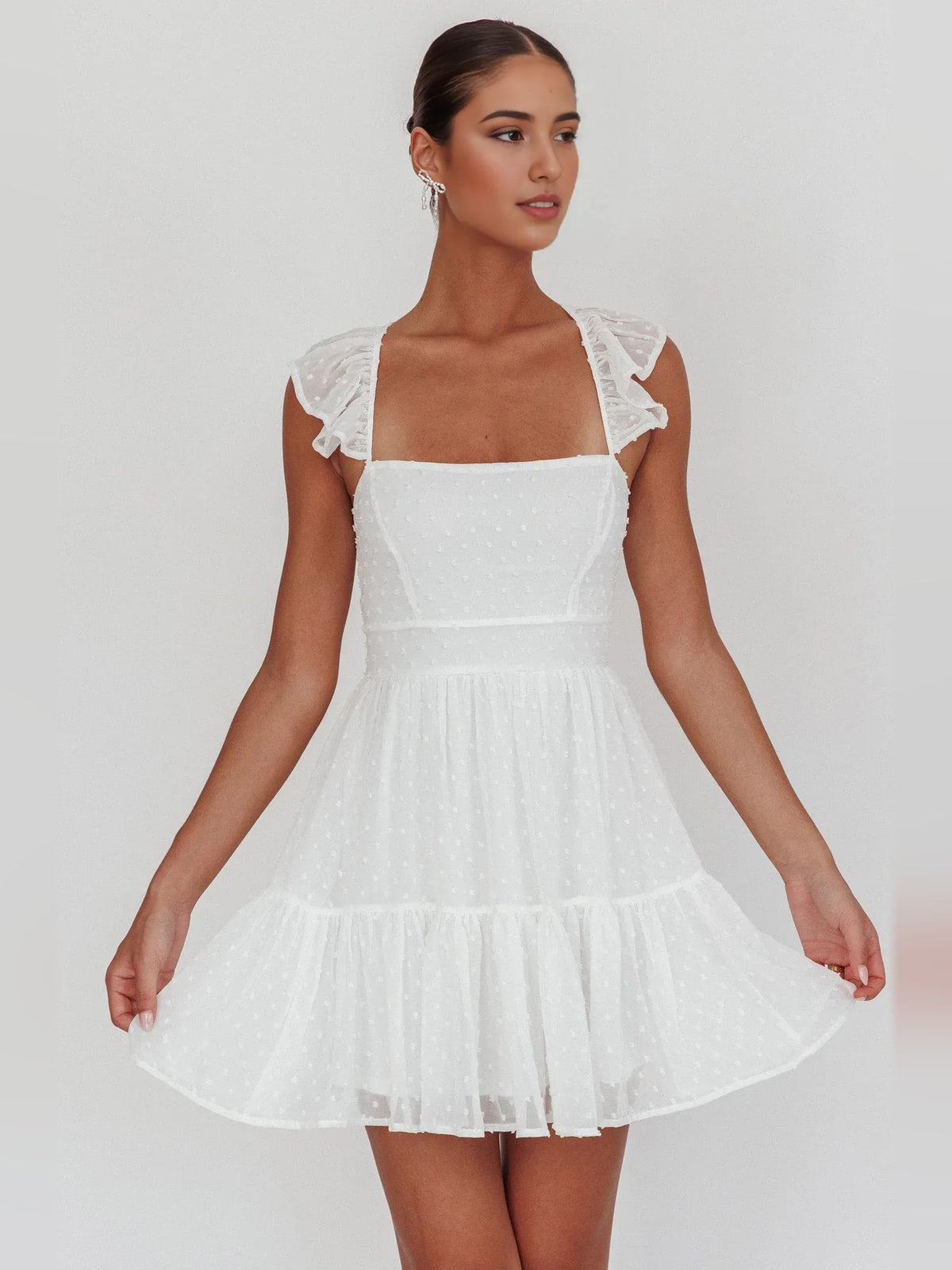 White tiered ruffle mini A-line dress with square neckline and cap sleeves