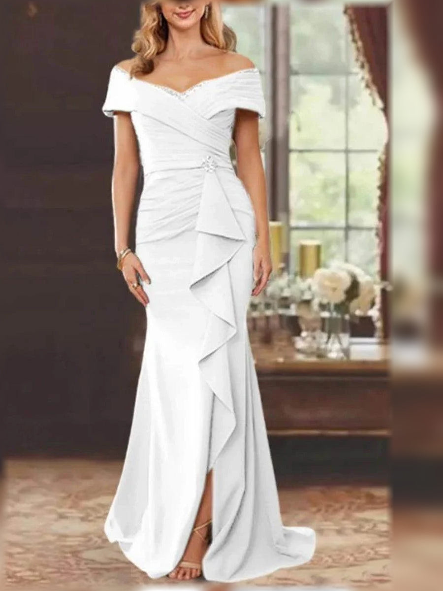 White off-shoulder mermaid gown with ruched bodice and cascading ruffle drape
