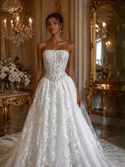 Ivory strapless corset wedding gown with embroidered floral lace bodice and A-line skirt