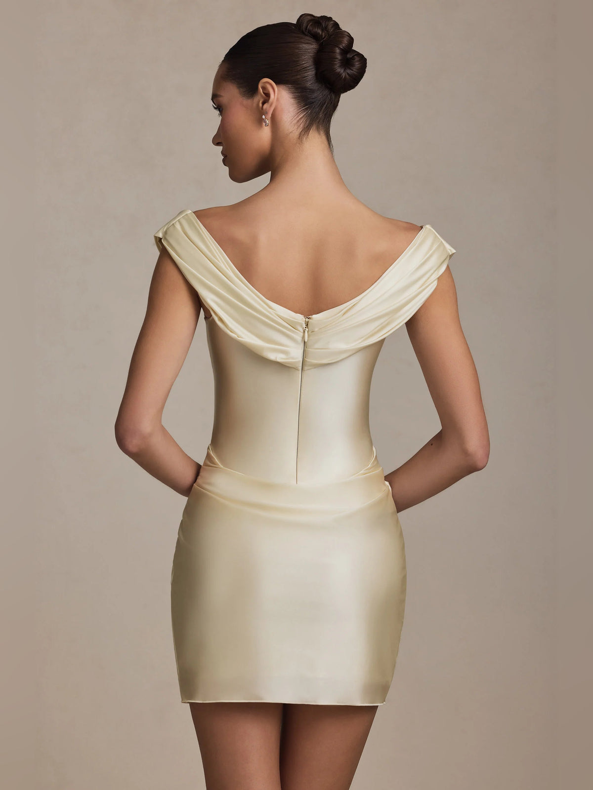 Ivory off-shoulder mini dress, back view with draped neckline and gathered straps