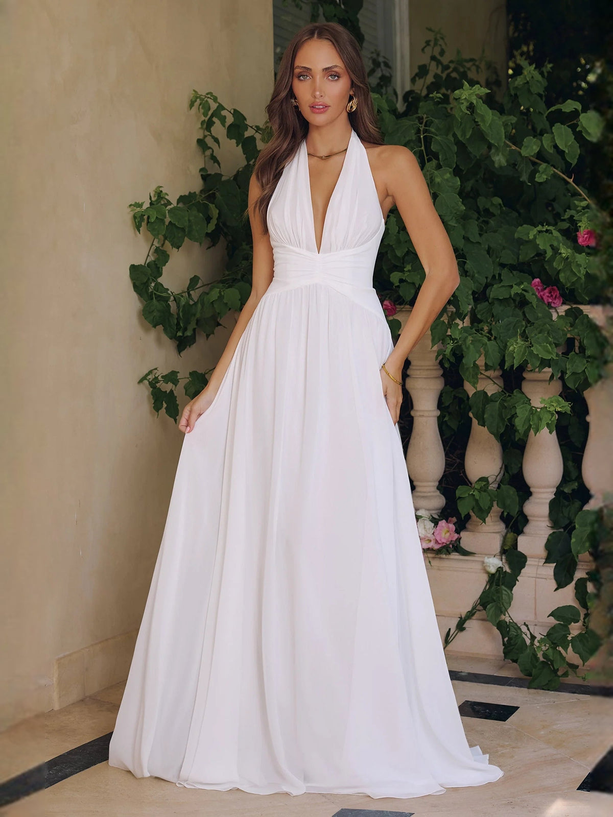 Ivory chiffon V-neck A-line wedding dress with ruched waist and full flowing skirt