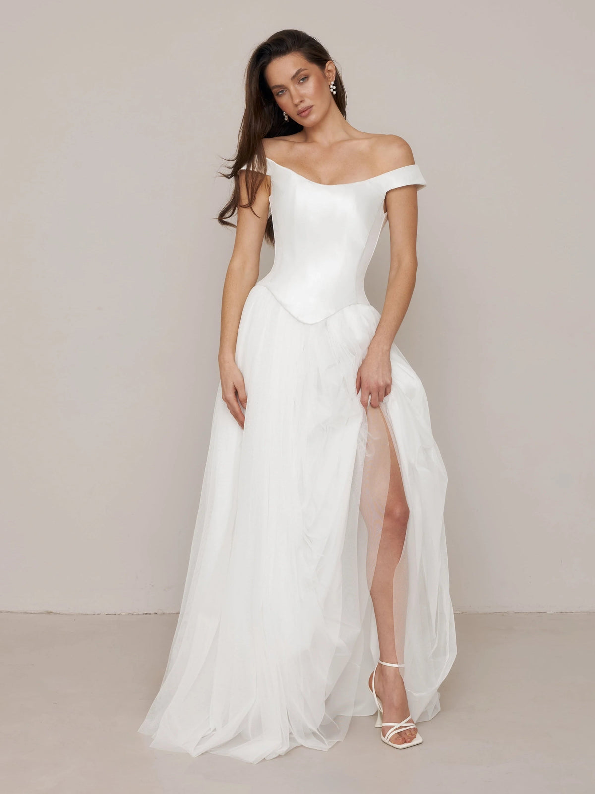 Ivory off-shoulder satin corset A-line wedding dress with draped back panel and slit