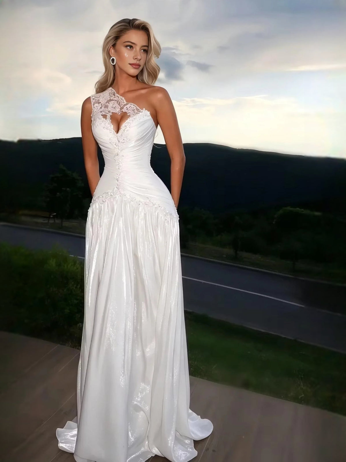 White one-shoulder prom dress with ruched bodice, lace floral applique, and A-line floor-length skirt