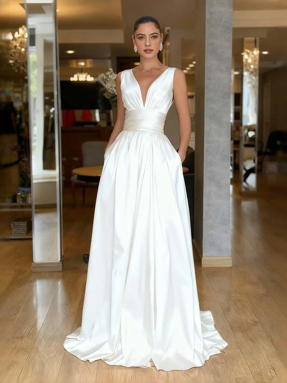 White V-neck A-line prom dress with ruched bodice and pleated floor-length skirt