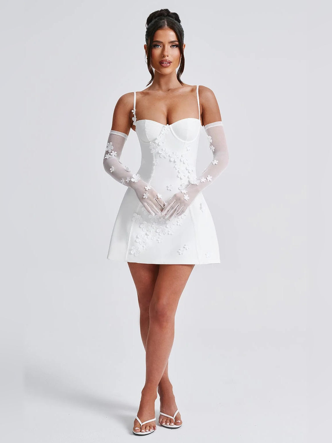 Ivory mini dress with sweetheart neckline, floral lace appliques, sheer gloves