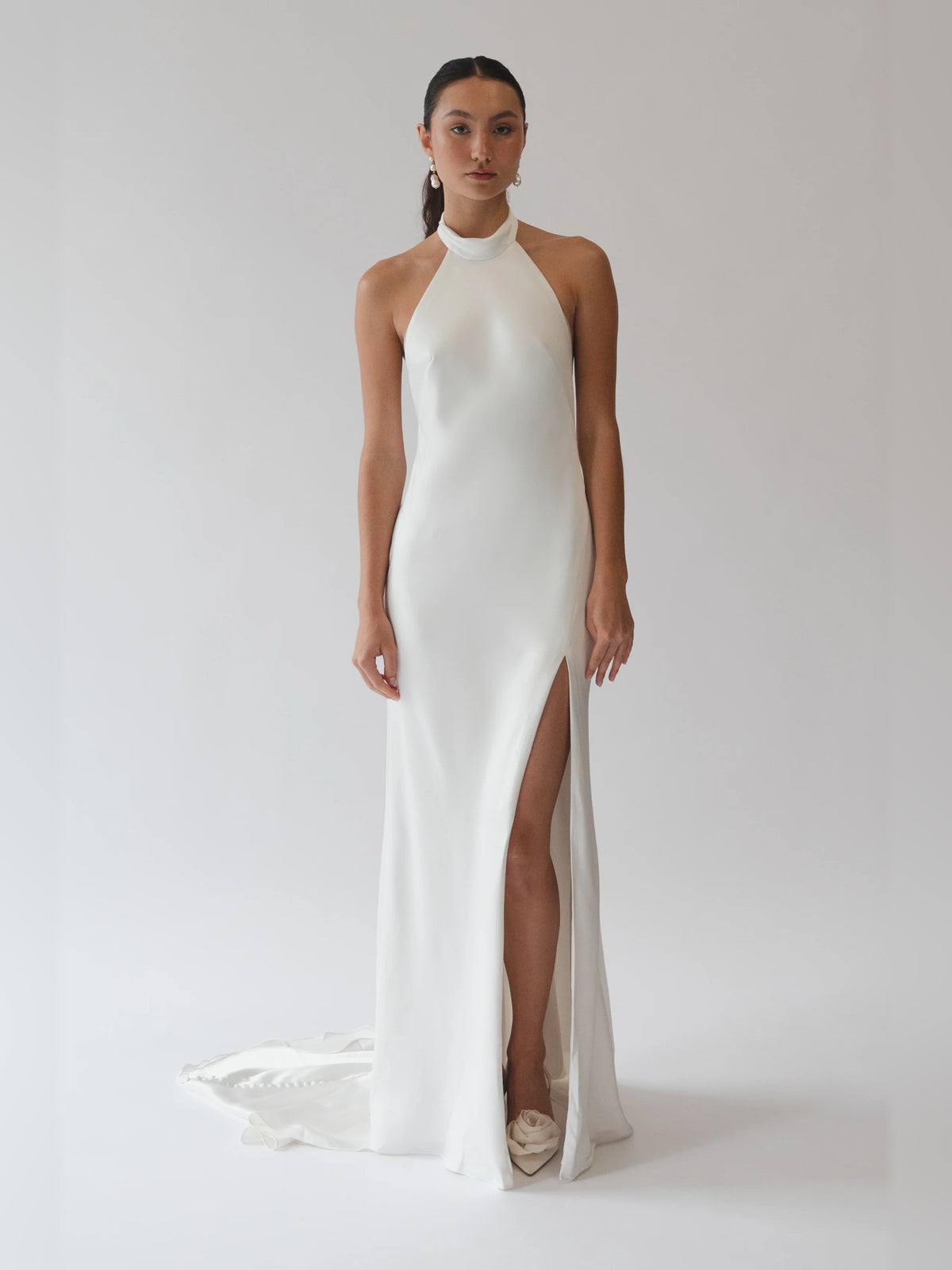 Ivory draped halter sheath formal dress with front slit and floor length hem