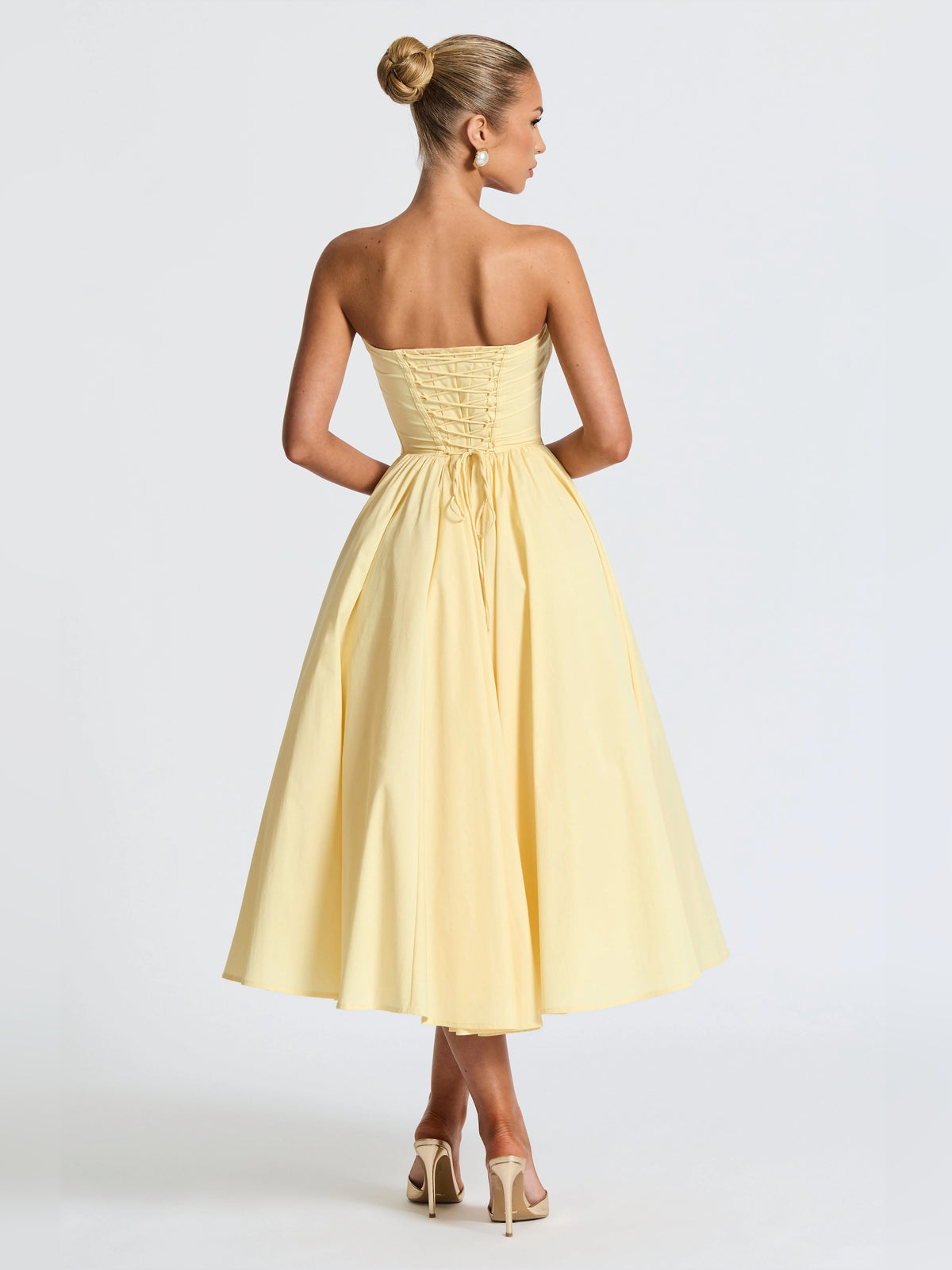Lemon yellow strapless midi formal dress back view with gathered waist and flared skirt