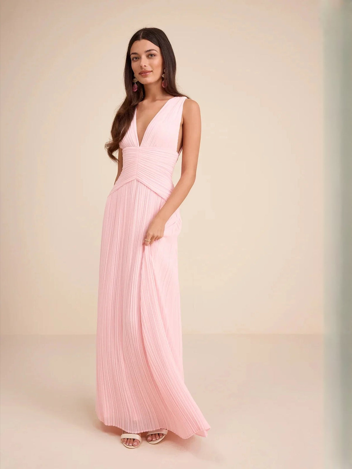 Light pink V-neck tiered maxi dress with ruched waist and pleated chiffon skirt